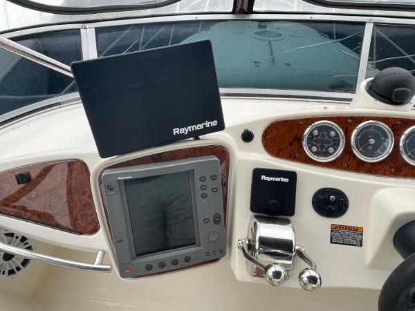 Slide: The Image of Control panel of 2004 Meridian 459 Motoryacht with Raymarine navigation equipment. - 13