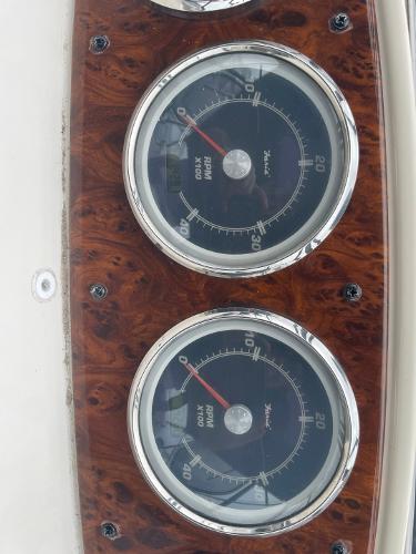 Slide: The Image of Close-up of 2004 Meridian 459 Motoryacht RPM gauges on wood panel. - 15