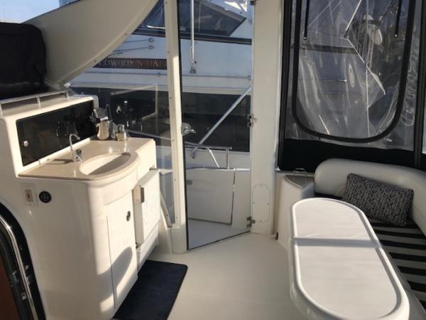 Slide: The Image of Interior of 2004 Meridian 459 Motoryacht with sink, seating, and window views. - 18