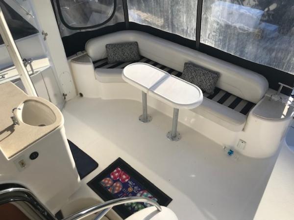 Slide: The Image of 2004 Meridian 459 Motoryacht interior with seating area and table. - 23