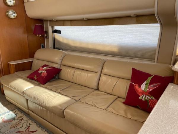 Slide: The Image of Luxurious interior of 2004 Meridian 459 Motoryacht with beige leather sofa and decorative pillows. - 25