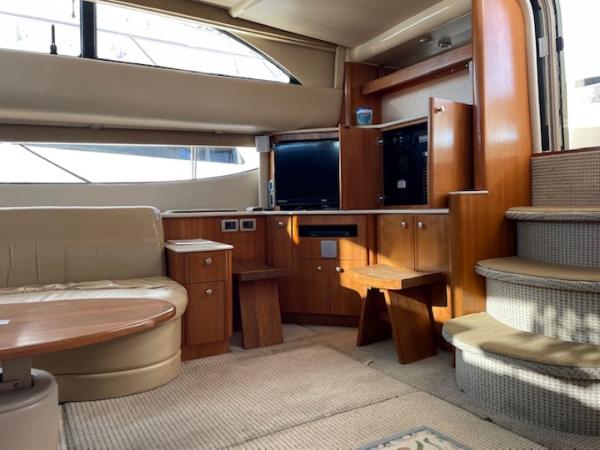 Slide: The Image of Luxurious interior of 2004 Meridian 459 Motoryacht with elegant wood finishes and comfortable seating. - 26