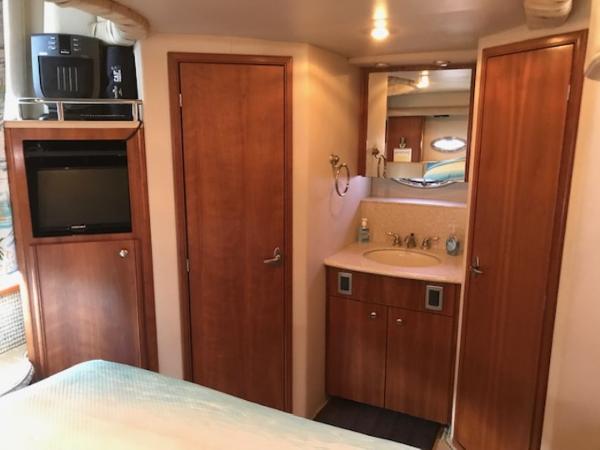 Slide: The Image of Interior of 2004 Meridian 459 Motoryacht with wood cabinetry and compact bathroom. - 32