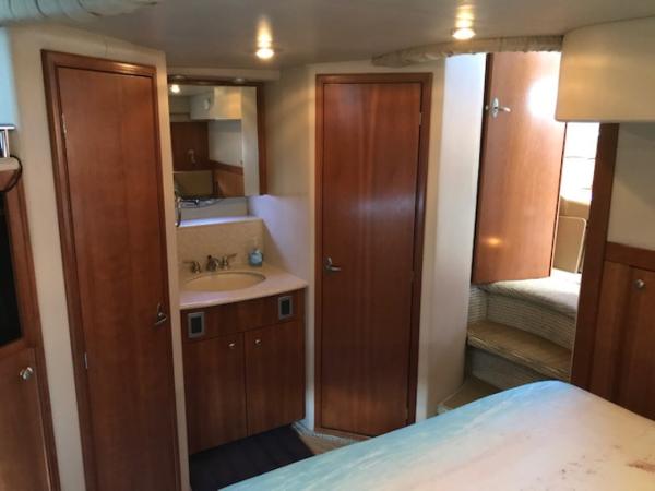 Slide: The Image of Interior of 2004 Meridian 459 Motoryacht with wood cabinetry and compact bathroom. - 34