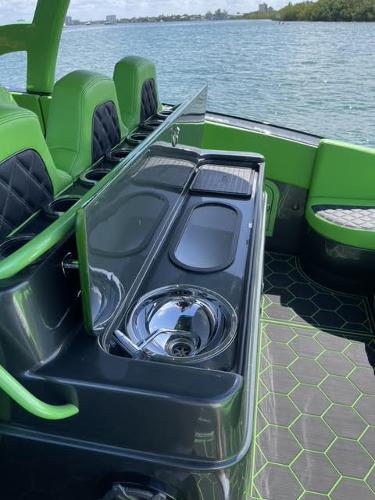 Slide: The Image of 2020 Midnight Express Open 43 boat interior with green accents and sleek design. - 9