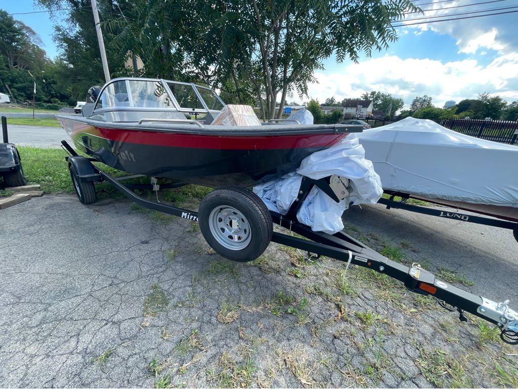 Slide: The Image of 2023 MirroCraft 1628 boat on a trailer, parked outdoors. - 13