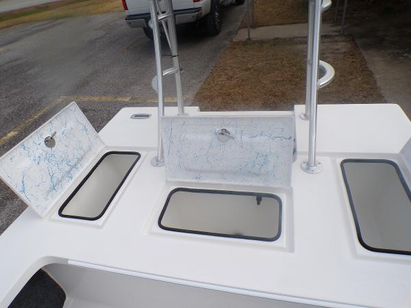 Slide: The Image of 2024 Mitzi Skiffs 17cc boat with open storage compartments and clean deck. - 12