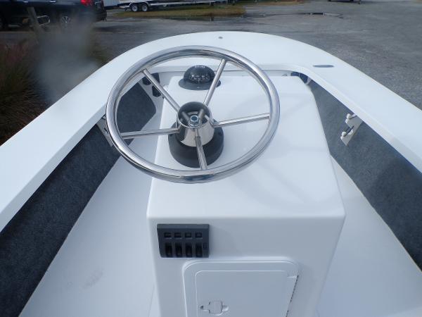Slide: The Image of 2024 Mitzi Skiffs 17cc boat console with steering wheel and navigation instruments. - 7