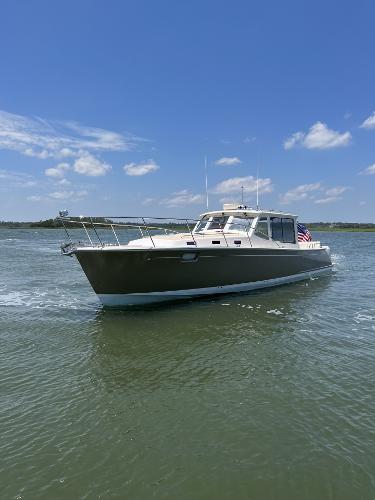 Slide: The Image of 2019 MJM 43z boat cruising on a sunny day. - 39