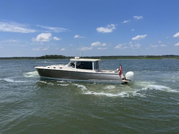 Slide: The Image of 2019 MJM 43z boat cruising on a sunny day. - 41