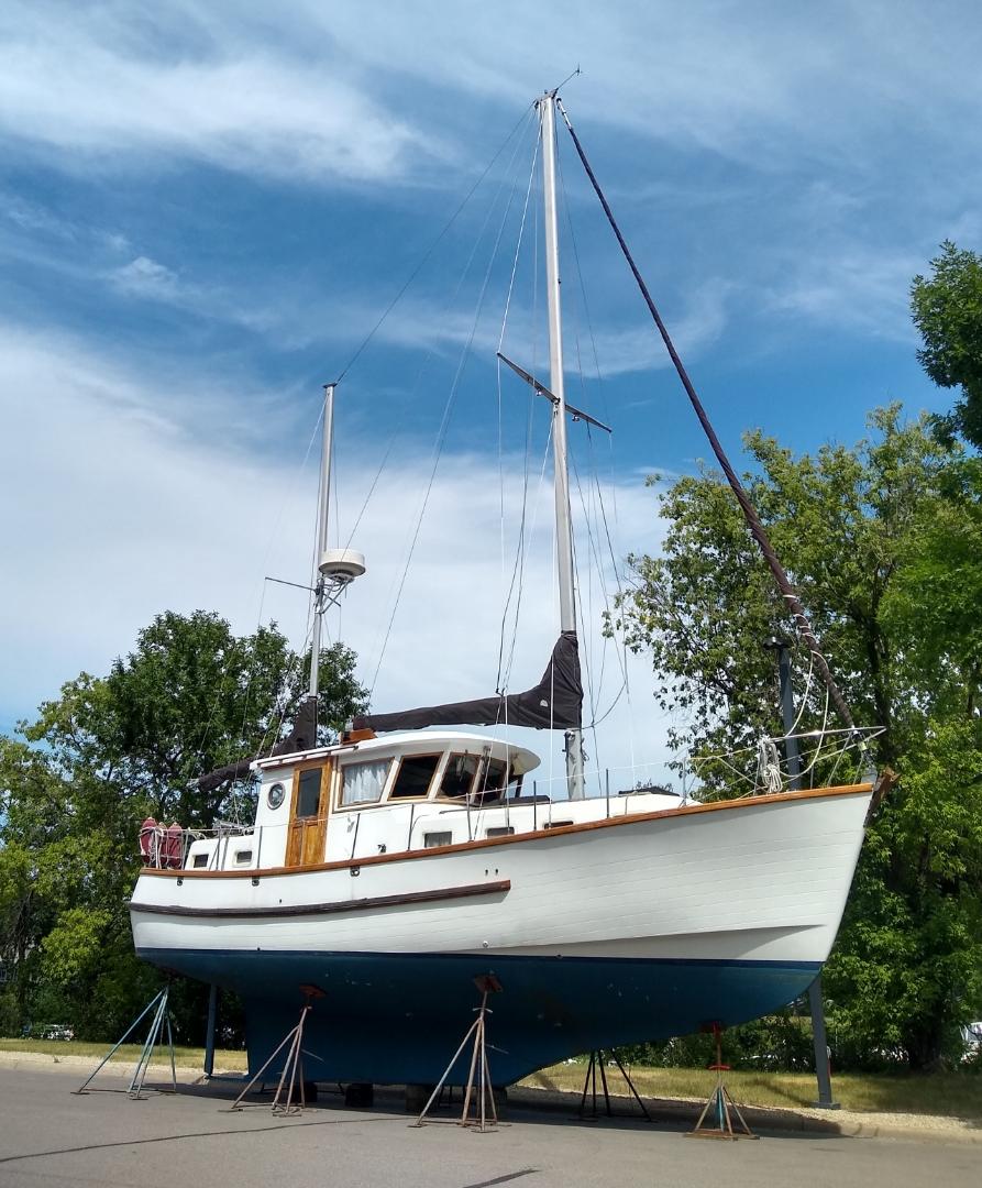 Slide: The Image of 1981 Monk Comfort Monk Motorsailer 38 on stands, ready for maintenance. - 9