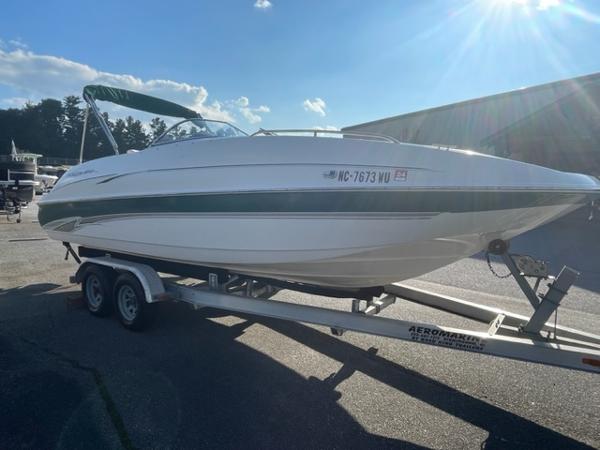 Slide: The Image of 2001 Monterey Explorer 220 Sport boat on trailer in outdoor setting. - 4