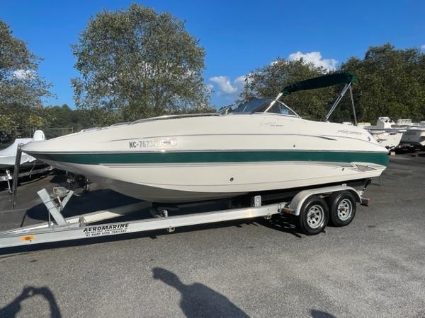Slide: The Image of 2001 Monterey Explorer 220 Sport boat on trailer in outdoor lot. - 5