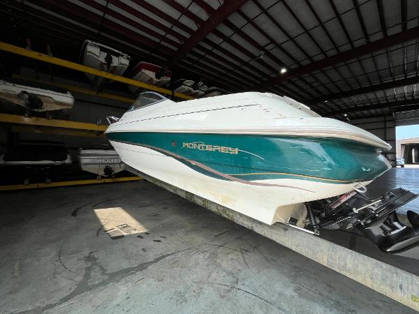 Slide: The Image of 1997 Monterey 236 Montura boat in storage facility. - 2