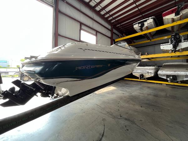 Slide: The Image of 1997 Monterey 236 Montura boat in storage facility. - 7