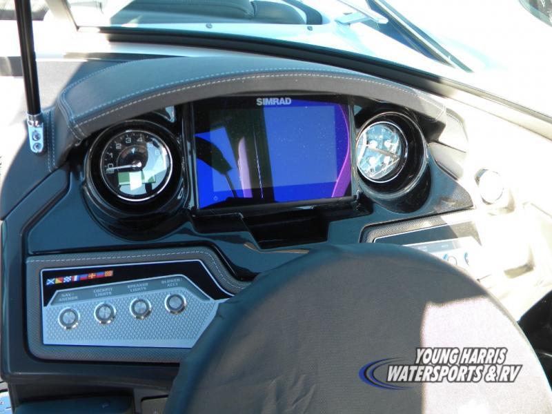 Slide: The Image of 2024 Monterey 238SS boat dashboard with Simrad display and control panel. - 11