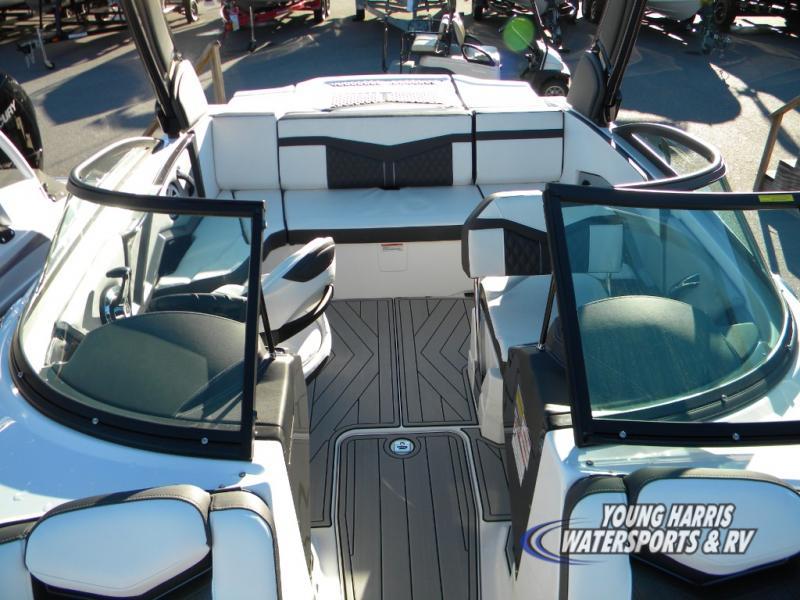 Slide: The Image of 2024 Monterey 238SS boat interior with white and black seating, open cockpit, and modern design. - 7
