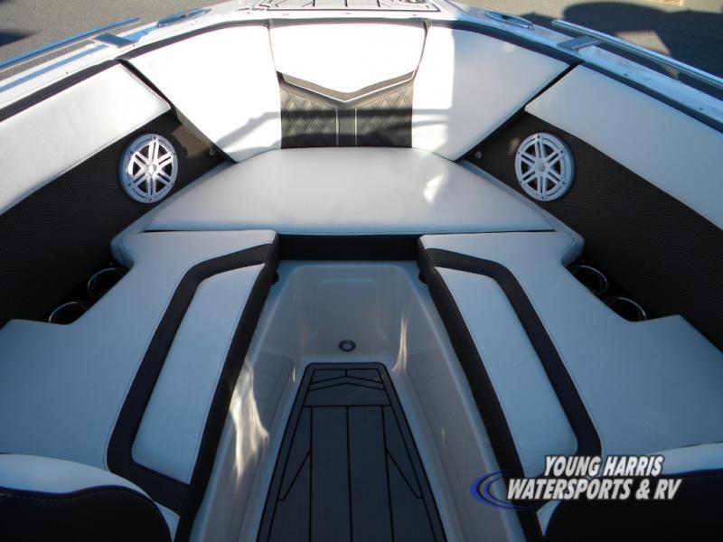 Slide: The Image of 2024 Monterey 238SS boat interior with cushioned seating and speakers. - 8