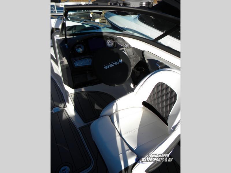 Slide: The Image of 2024 Monterey 238SS boat cockpit with white seating and modern dashboard. - 9