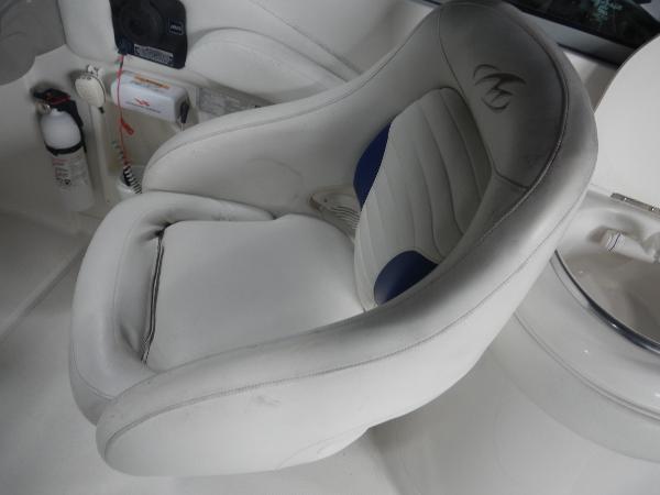Slide: The Image of Captain's chair in a 2005 Monterey 248 LS boat interior. - 15