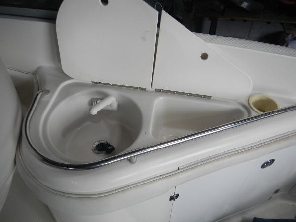 Slide: The Image of 2005 Monterey 248 LS boat sink and countertop area. - 16