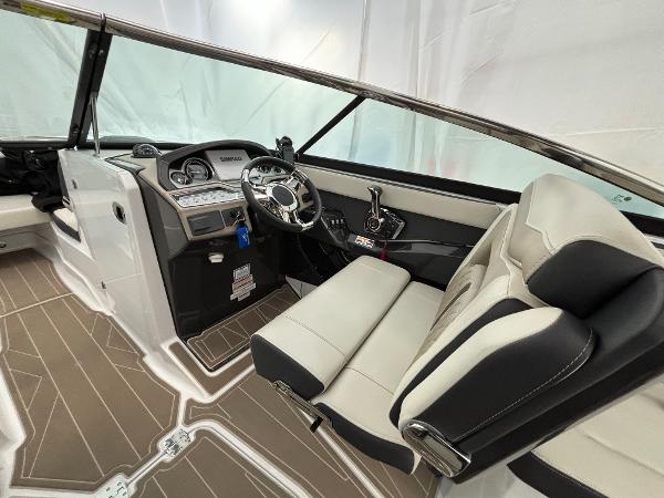 Slide: The Image of 2023 Monterey 275 SS boat interior with modern dashboard and seating. - 10