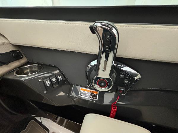 Slide: The Image of 2023 Monterey 275 SS boat control panel with throttle and switches. - 11