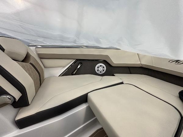 Slide: The Image of 2023 Monterey 275 SS boat interior with beige and black seating. - 15