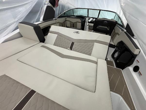 Slide: The Image of 2023 Monterey 275 SS boat interior with luxurious beige and brown seating. - 3