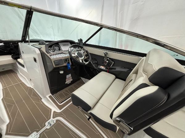 Slide: The Image of 2023 Monterey 275 SS boat interior with modern dashboard and comfortable seating. - 9