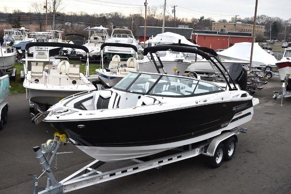 Slide: The Image of 2024 Monterey 275SS black boat on trailer at marina. - 1