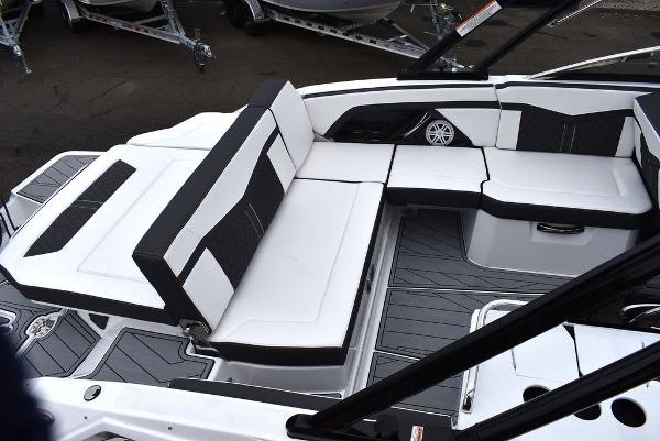 Slide: The Image of 2024 Monterey 275SS boat interior with white and black seating. - 10
