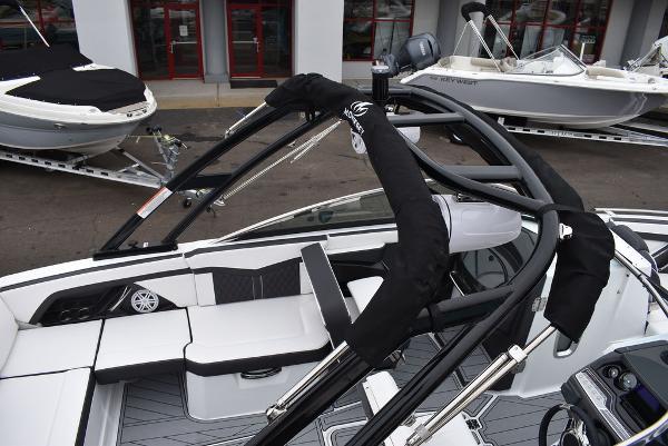 Slide: The Image of 2024 Monterey 275SS boat interior with sleek seating and modern design. - 13