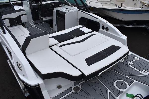 Slide: The Image of 2024 Monterey 275SS boat interior with white and black seating and modern design. - 27