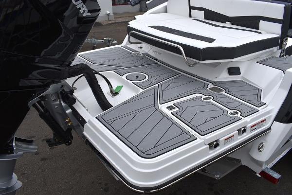 Slide: The Image of 2024 Monterey 275SS boat stern with swim platform and outboard motor. - 7