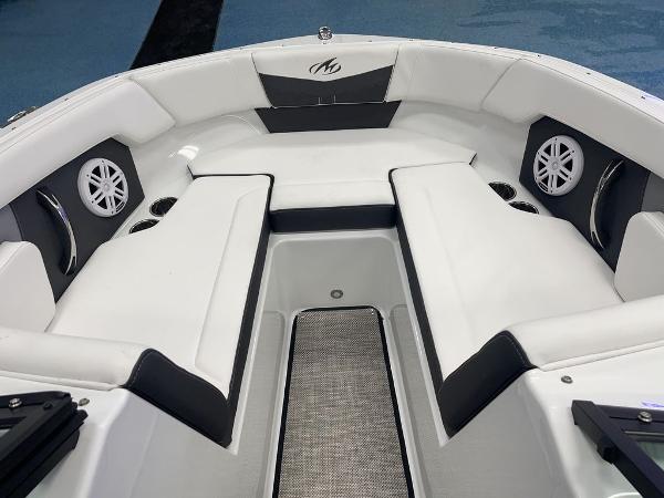 Slide: The Image of Interior of 2023 Monterey M-20 boat with white seating and built-in speakers. - 10