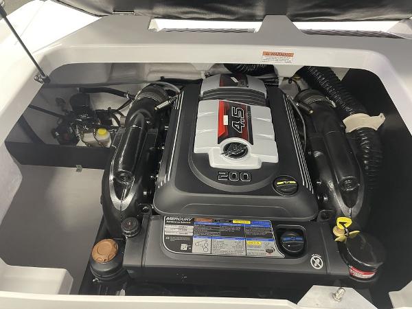 Slide: The Image of 2023 Monterey M-20 boat engine compartment with Mercury 4.5L 200 HP engine. - 13