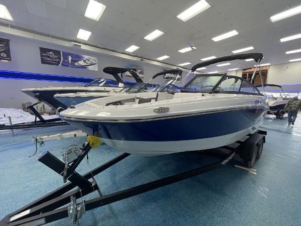 Slide: The Image of 2023 Monterey M-20 boat on trailer in showroom. - 2