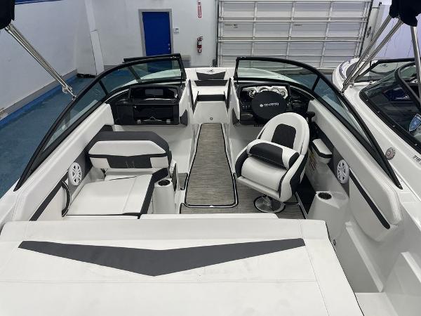Slide: The Image of 2023 Monterey M-20 boat interior with black and white seating, steering console, and modern design. - 3
