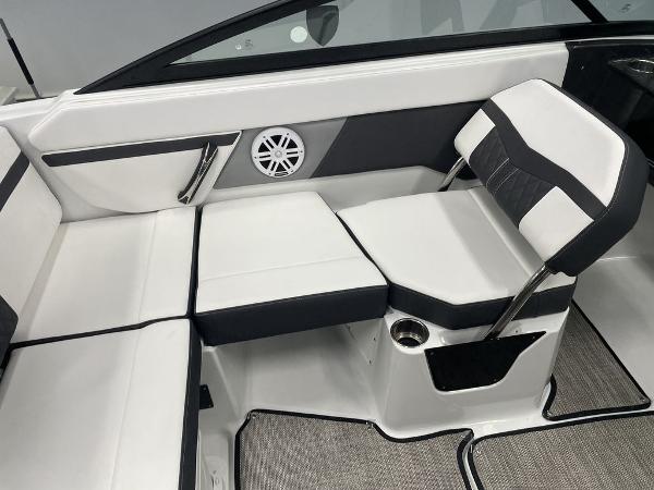 Slide: The Image of 2023 Monterey M-20 boat interior with white and black seating, speaker, and cup holder. - 4