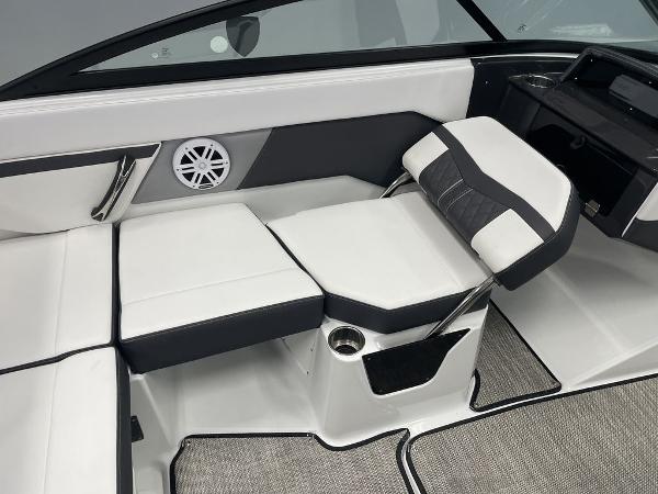 Slide: The Image of 2023 Monterey M-20 boat interior with white and black seating, speaker, and cup holder. - 5