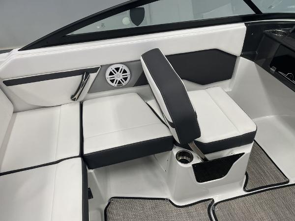 Slide: The Image of 2023 Monterey M-20 boat interior with white and black seating, speaker, and cup holder. - 6
