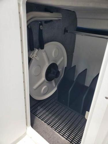 Slide: The Image of 2023 Monterey M-45 boat storage compartment with table and accessories. - 13