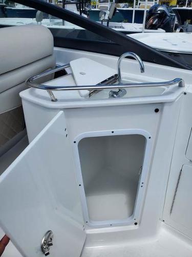 Slide: The Image of 2023 Monterey M-45 boat interior with open storage compartment and sink. - 14