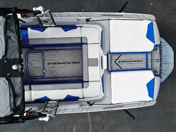 Slide: The Image of 2019 Moomba Makai boat interior with white and blue seating. - 10