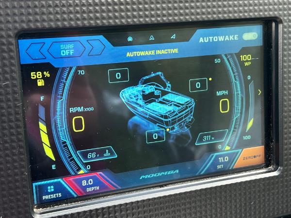 Slide: The Image of 2019 Moomba Makai boat dashboard display showing Autowake settings and performance metrics. - 11