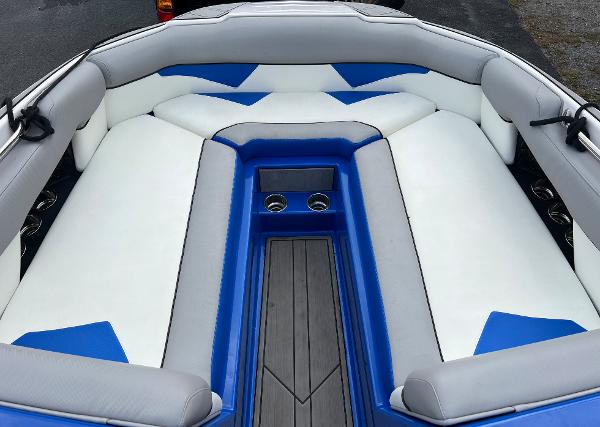 Slide: The Image of 2019 Moomba Makai boat interior with white and blue seating. - 13