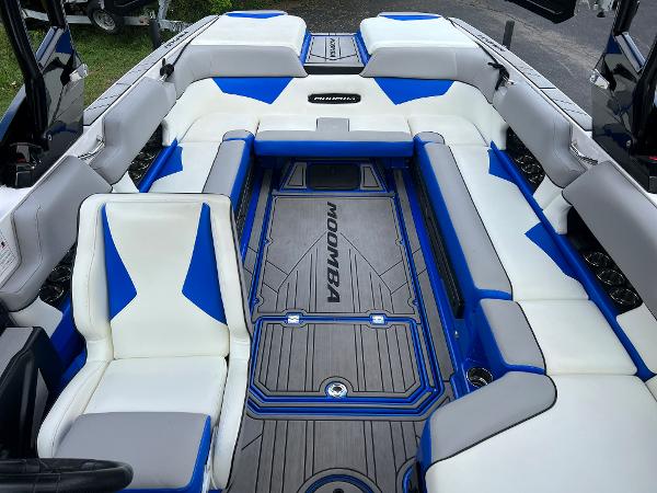 Slide: The Image of 2019 Moomba Makai boat interior with blue and white seating. - 14