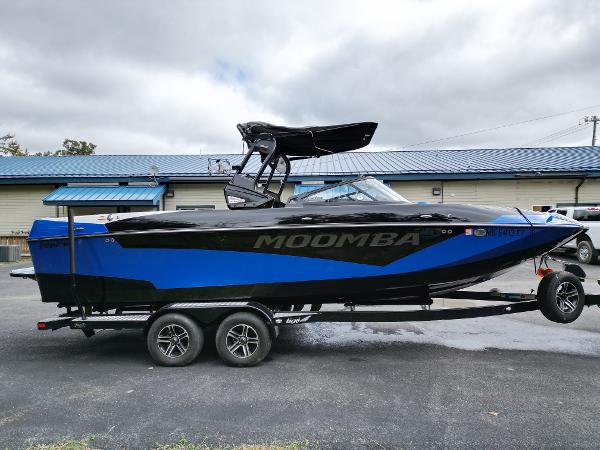 Slide: The Image of 2019 Moomba Makai boat on a trailer, blue and black exterior. - 5