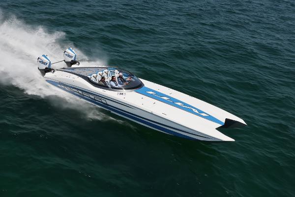 Slide: The Image of 2022 MTI 390X speedboat racing on open water. - 2